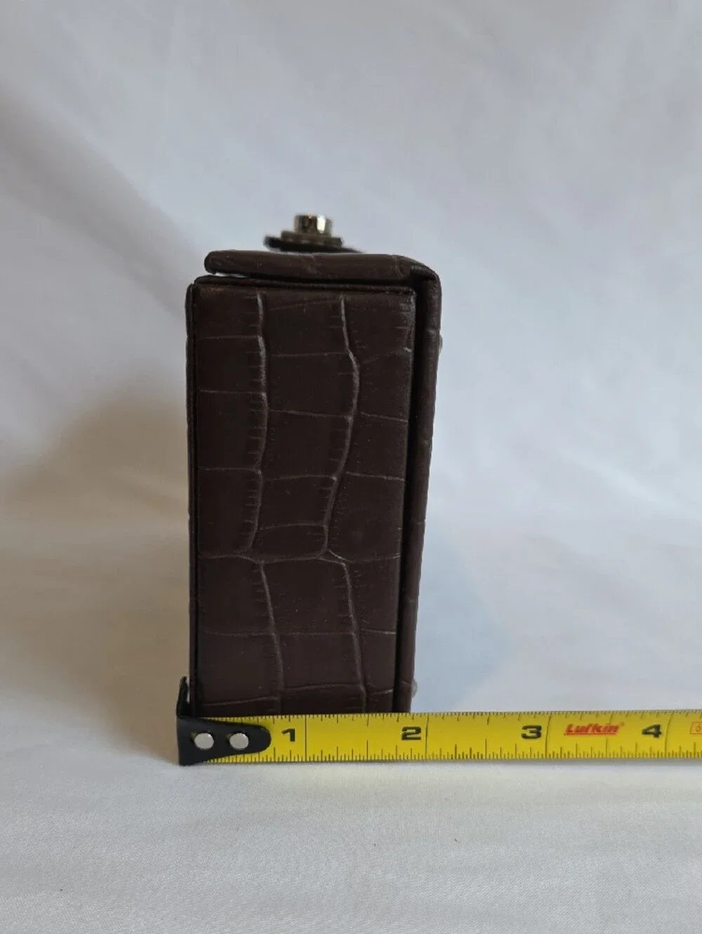 A brown crocodile-embossed faux leather jewelry and watch display box